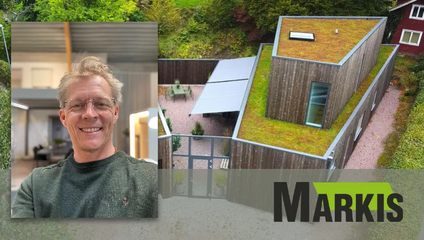 Leende man från medlemsföretaget Markis i Kungsbacka bredvid ett hus med markiser och grönt tak